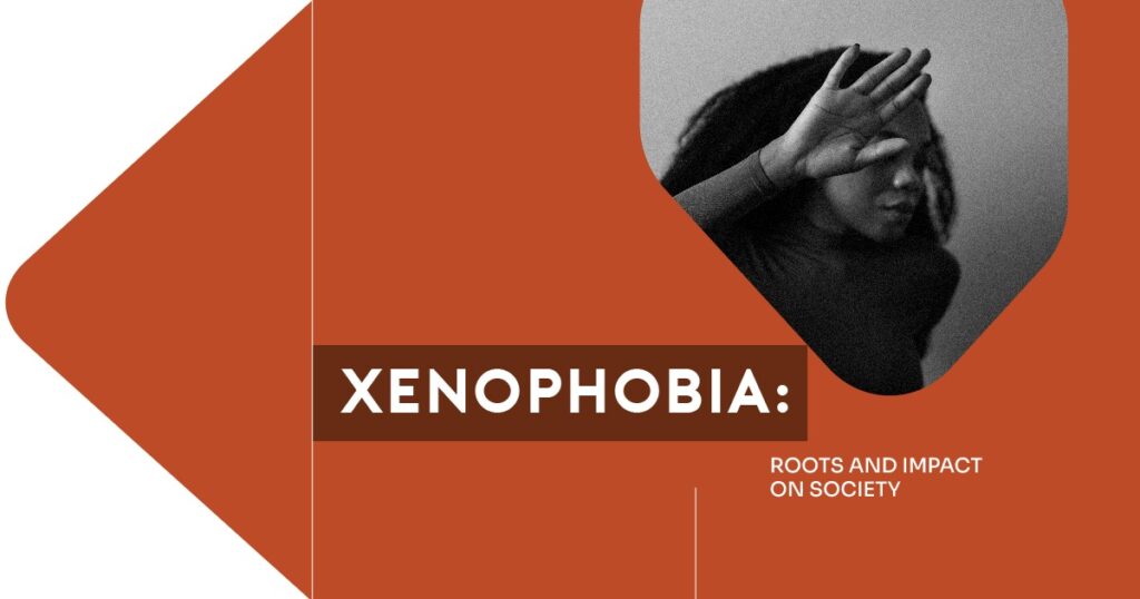A person raising a hand to shield their face, symbolizing fear or exclusion, alongside the text “Xenophobia: Roots and Impact on Society” on a bold orange background.